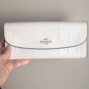Cream coach clutch wallet
